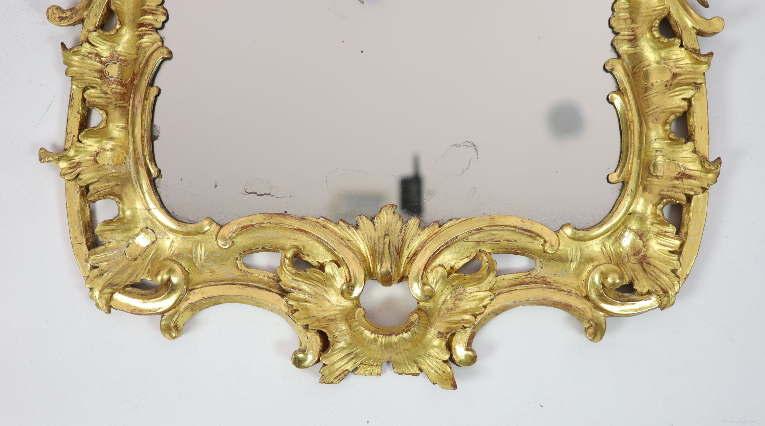 A George III carved giltwood wall mirror, W.67cm H.116cm